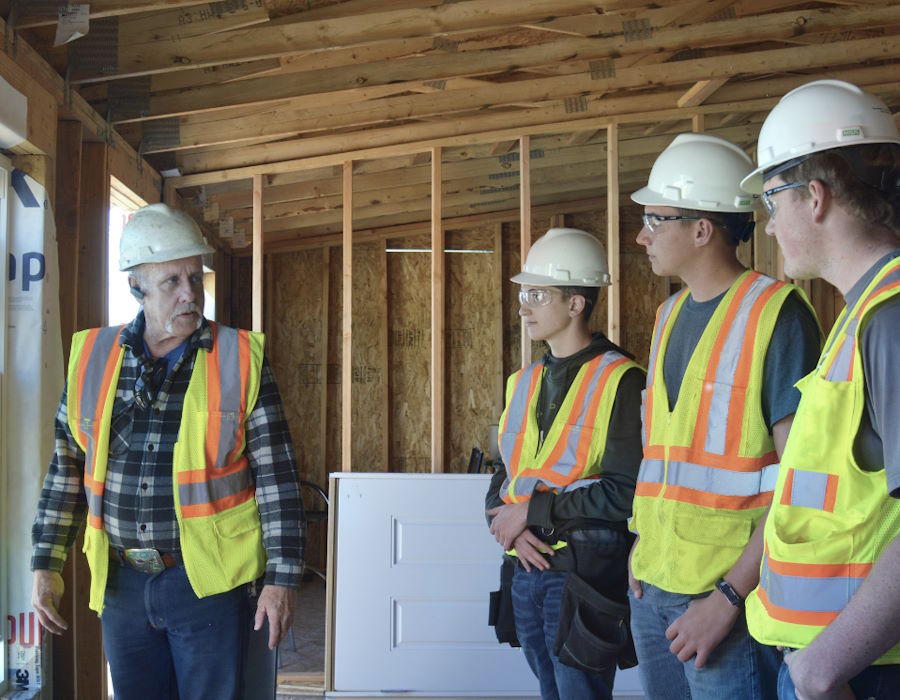 Instructor and Careers in Construction Colorado Students inside home being built